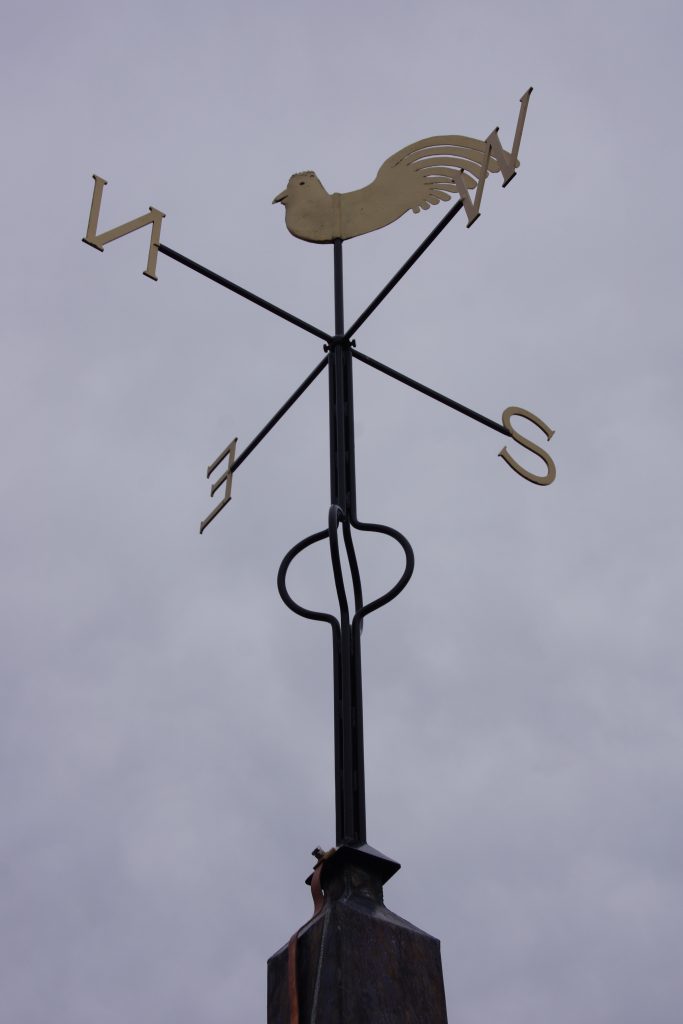 The weathervane with refinished cockerel, new ironwork and wood support